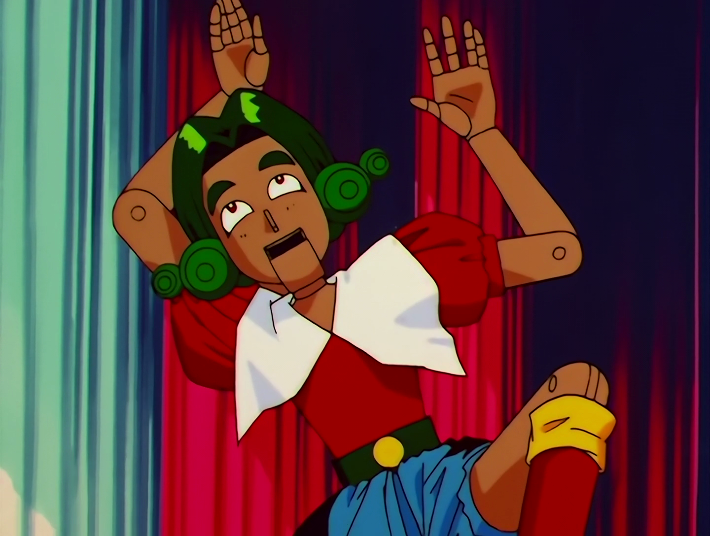 Kurumiwario, a Lemures from Sailor Moon episode 145. He’s a wooden nutcracker doll with green curly hair styled like an 18th century wig. He’s wearing a red shirt with puffed sleeves and a huge white collar.